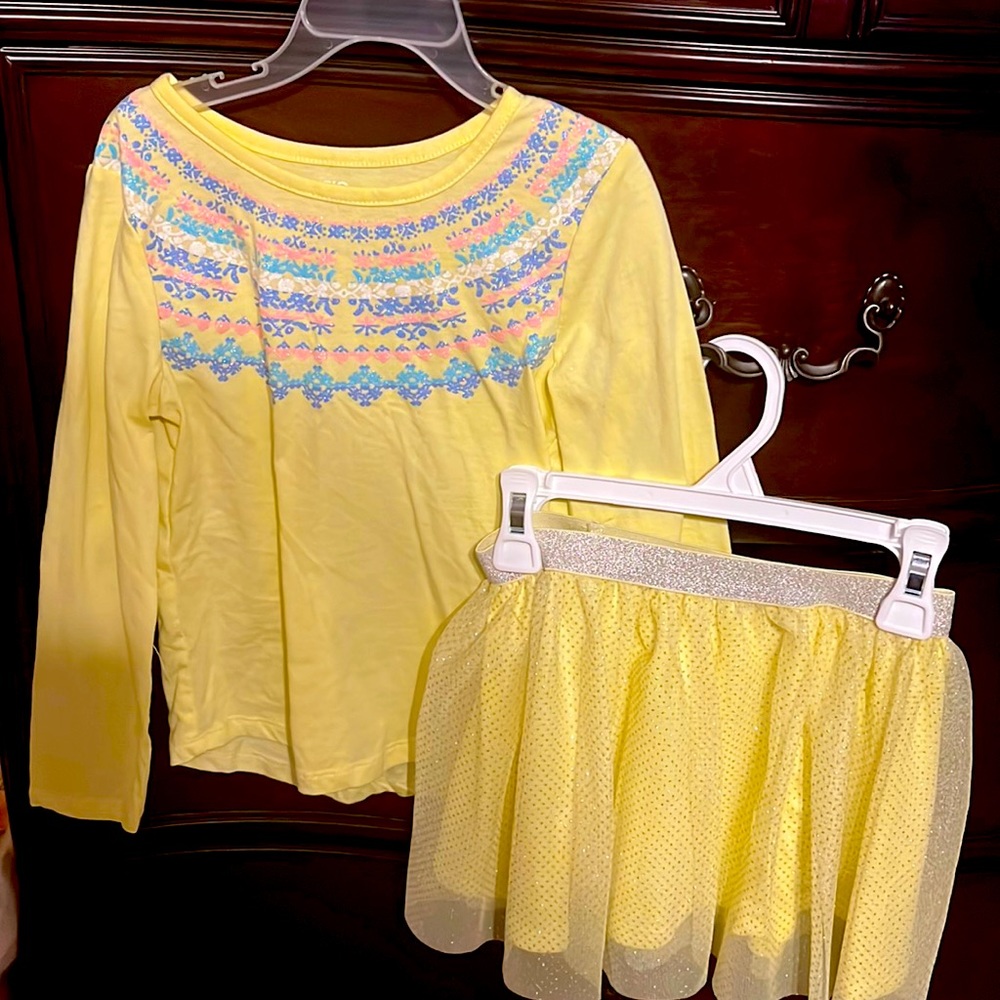 Epic threads top in yellow with colored designs at the top with a matching skirt